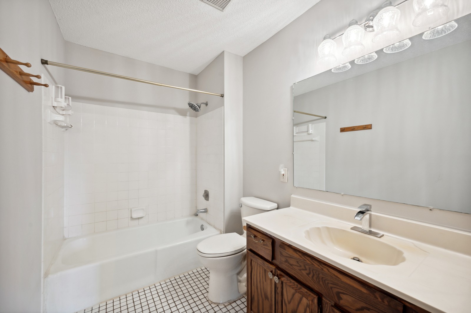 Clean and modern bathroom at Blossom Hill Assisted Living in Woodbury, MN, featuring sleek fixtures and bright lighting